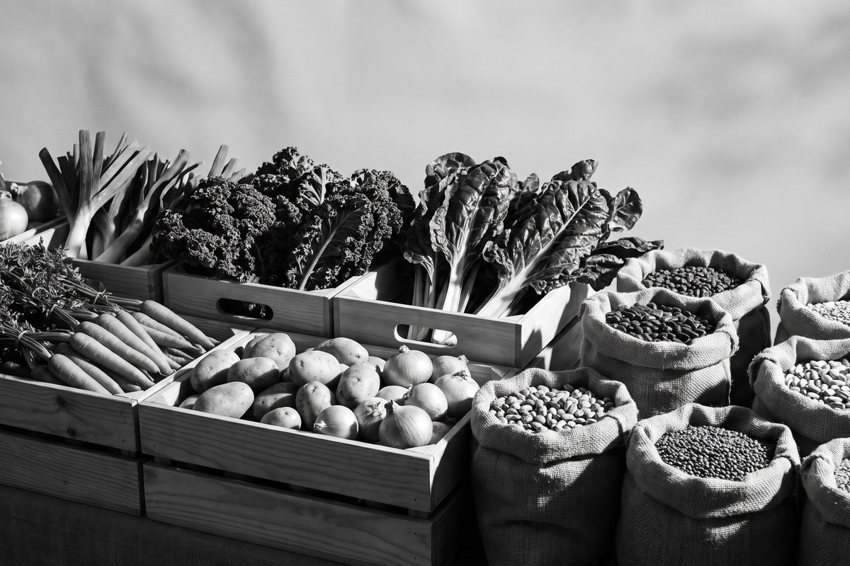 Fresh vegetables and dried legumes at a market stall