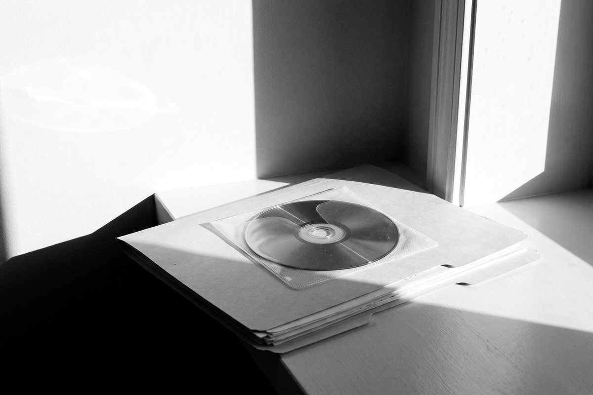 An imaging disc on a folder of medical reports